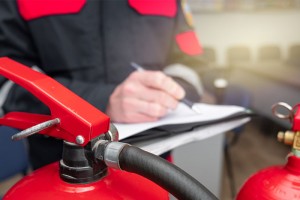 Why do extinguishers need to be serviced by a qualified/competent person? 